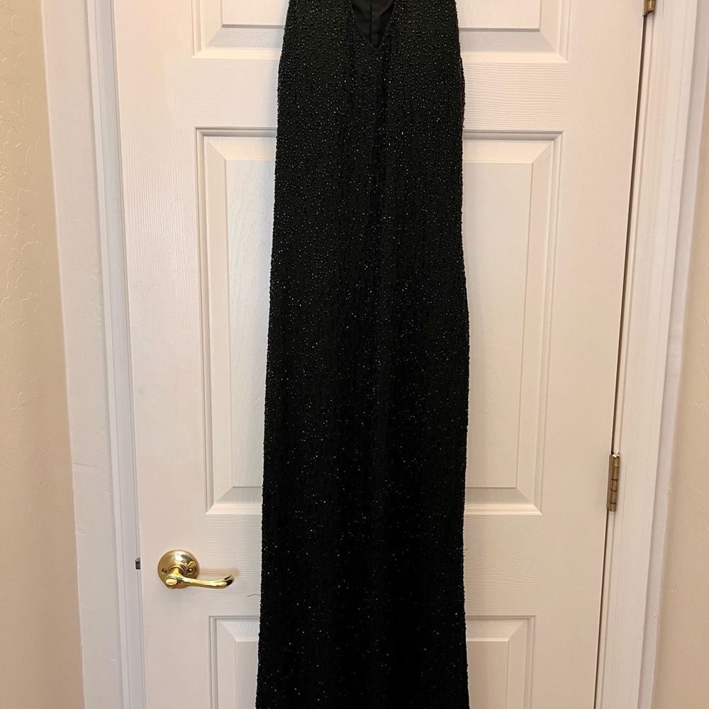 Elegant Black Beaded Sleeveless/Halter Style Gown/Prom. Brand is Jump, size 3